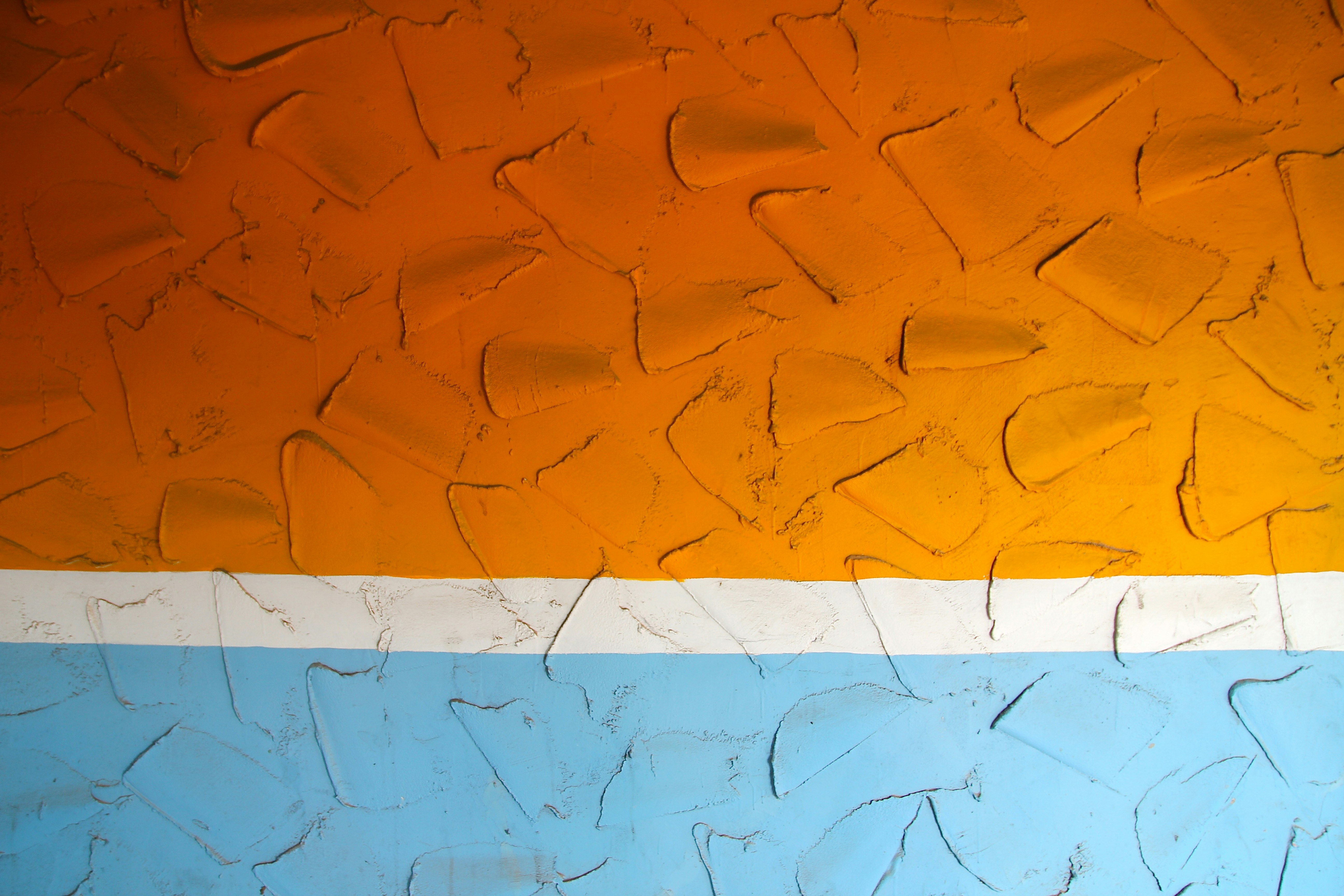photo of orange, white, and blue artwork